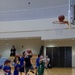 Coaches from Basketball Japan Academy coach children at the Youth Sports Summer Basketball Camp