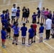 Coaches from Basketball Japan Academy coach children at the Youth Sports Summer Basketball Camp