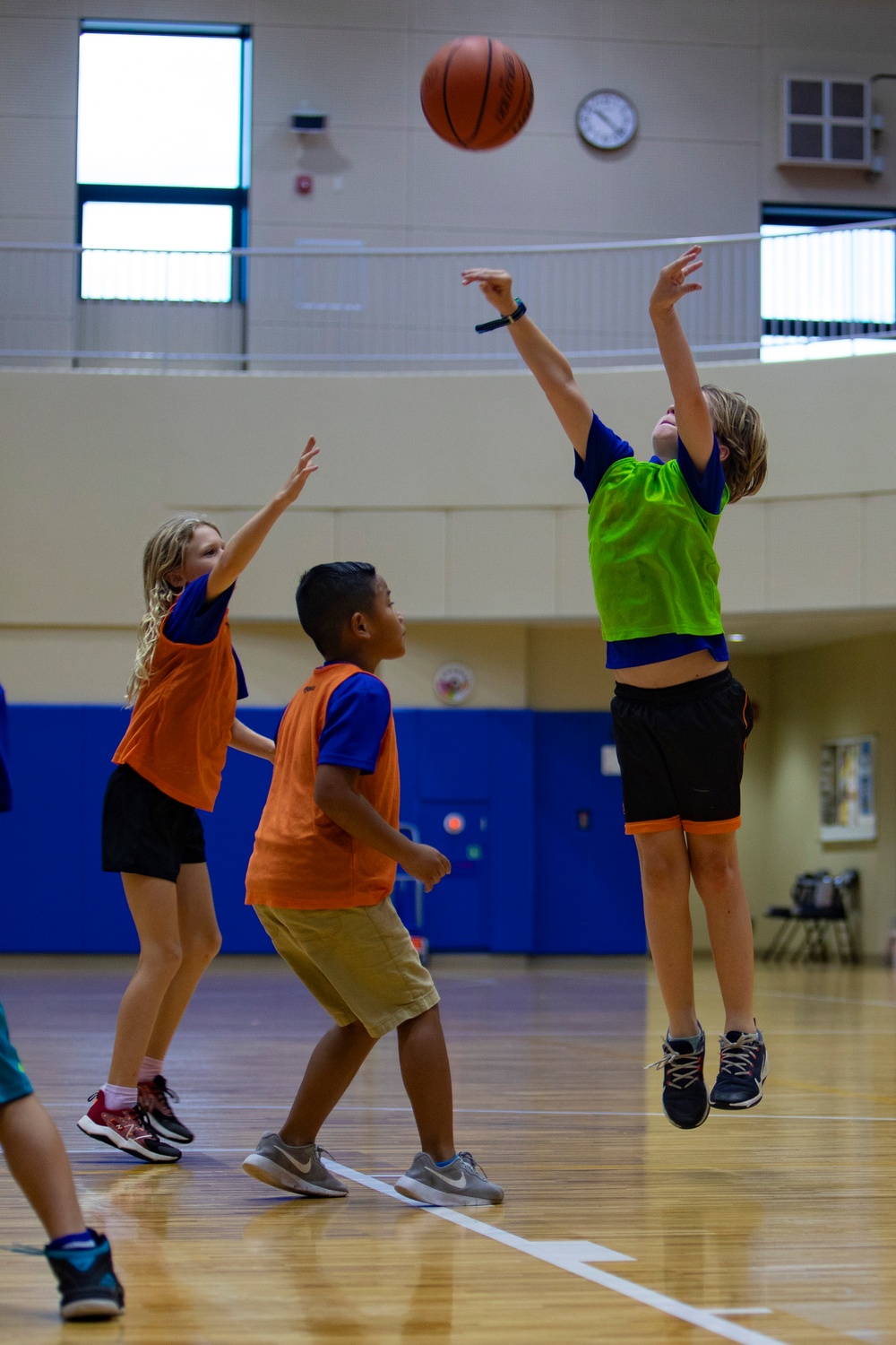 Coaches from Basketball Japan Academy coach children at the Youth Sports Summer Basketball Camp