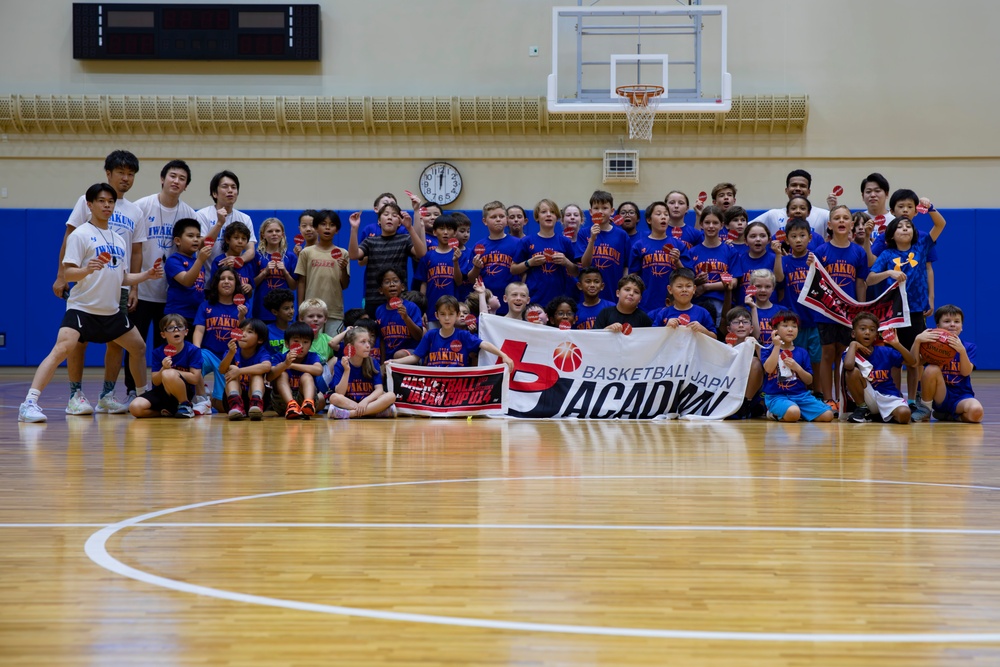 Coaches from Basketball Japan Academy coach children at the Youth Sports Summer Basketball Camp