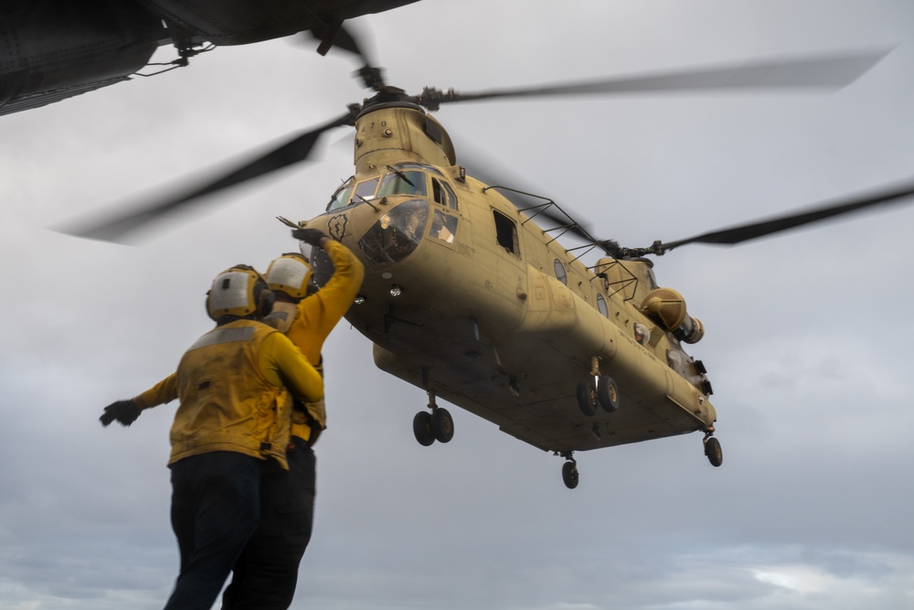 U.S. Army CH-47 Chinook and AH-64 Apache deck landing qualifications aboard USS Somerset