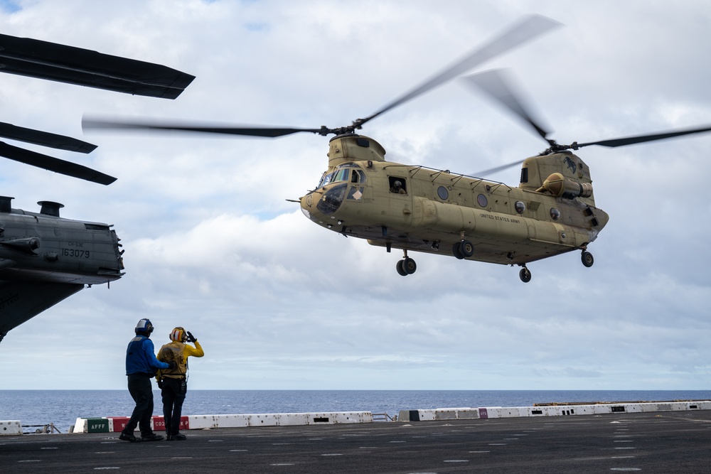 U.S. Army CH-47 Chinook and AH-64 Apache deck landing qualifications aboard USS Somerset