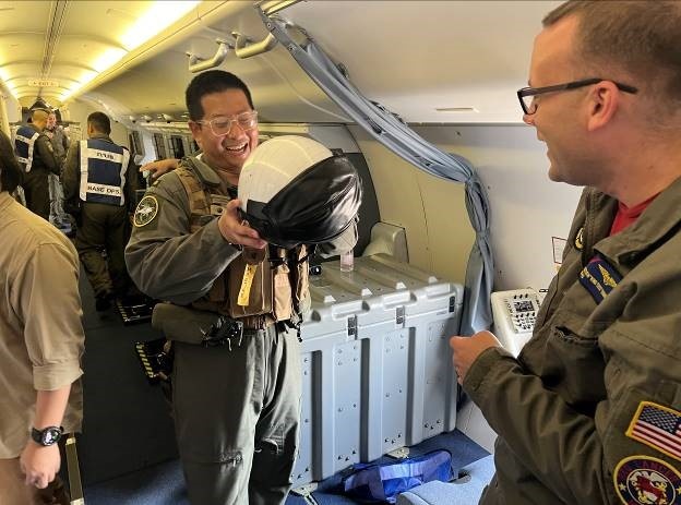 PATTAYA, Thailand, (July 23, 2024) Sailors assigned to Patrol Squadron (VP) 10 show the P-8A flight crew equipment and survival equipment during a tour of a static display during CARAT Thailand, July 23, 2024.