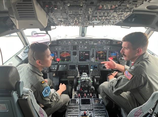 PATTAYA, Thailand, (July 23, 2024) Lt. Robert Rich, right, a pilot assigned to Patrol Squadron (VP-10), conducts training on a P-8A Poseidon with an officer assigned to Royal Thai Navy Air Division 101 Squadron during a static display.