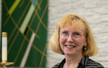 Dr. Grace Yeuel Stands in the Clay Kaserne Chapel