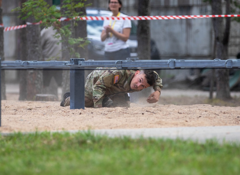 Sgt. Trenton Tuberosa crawls through an obstacle