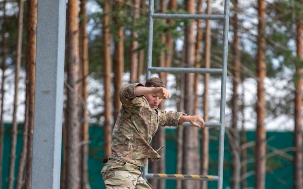 1st Lt. Layton Thorpe jumps off an obstacle
