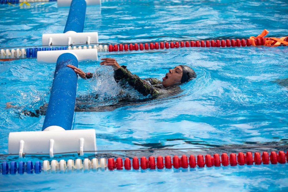 1st Lt. Jessica Romero pushes off an obstacle