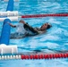 1st Lt. Jessica Romero pushes off an obstacle