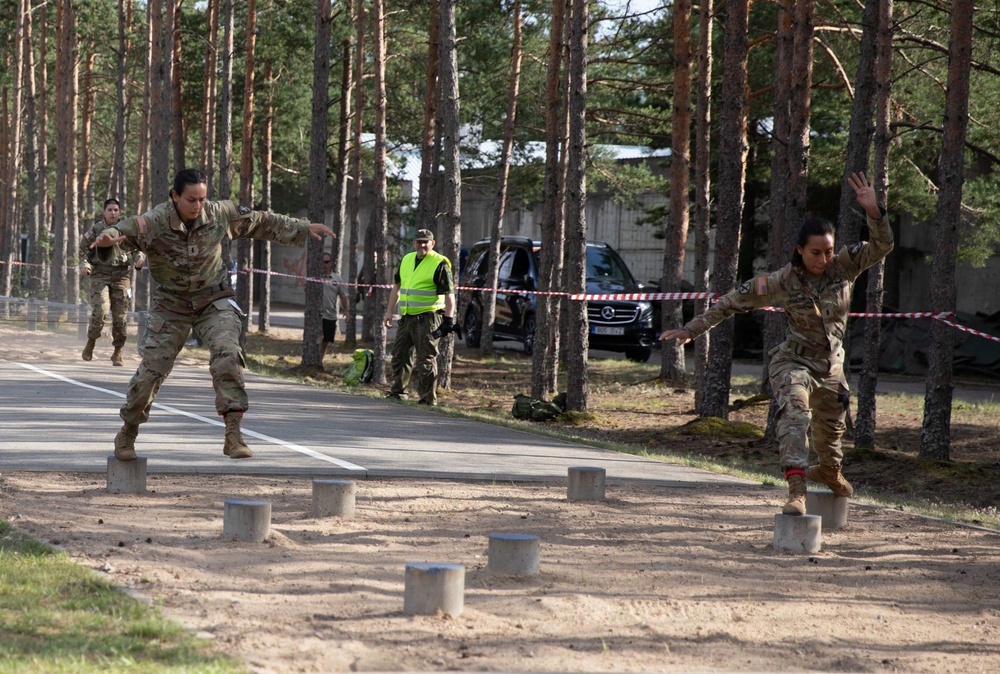 1st Lt. Jessica Romero and 1st Lt. Brianna Mirmina jump from step to step