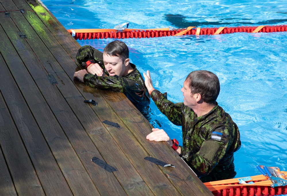 Col. Brent Dishman congratulates Staff Sgt. Zachary Mills