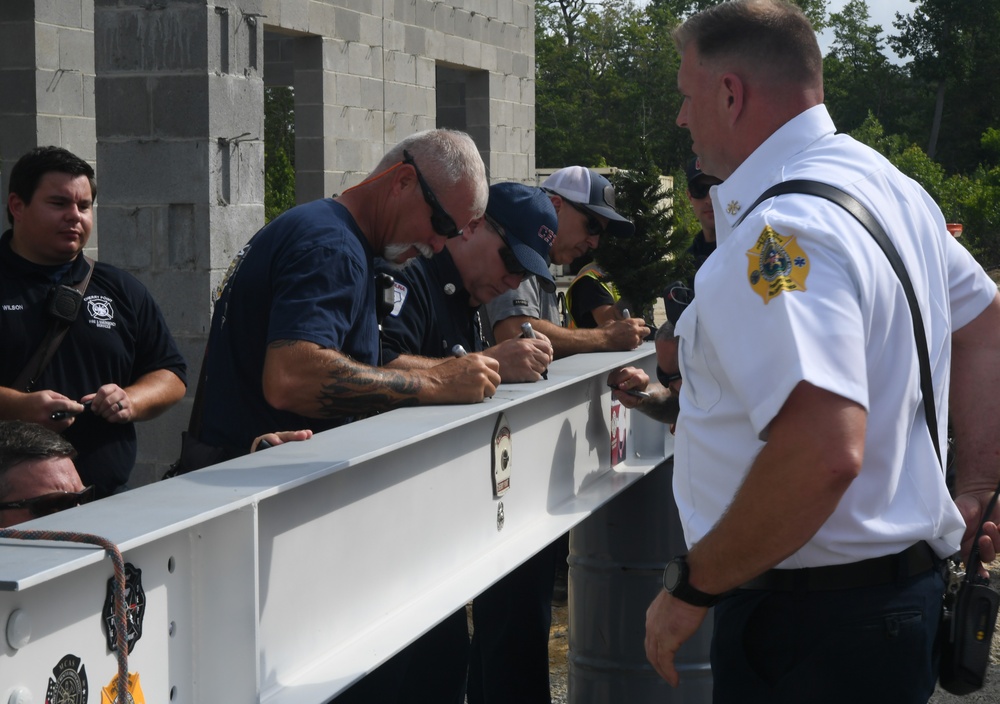 OICC Florence completes final topping out ceremony for fire station construction