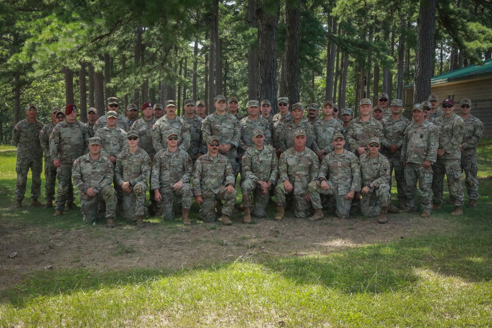 National Guardsmen from varying states pose for a group photo after the Marksmanship Advisory Council Region Five Match