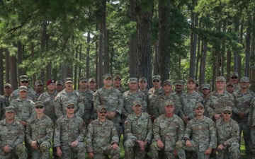 National Guardsmen from varying states pose for a group photo after the Marksmanship Advisory Council Region Five Match