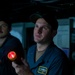 USS Tripoli Sailors Stand watch on the bridge