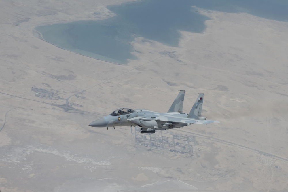 U.S. KC-135s refuel Qatari F-15s during exercise Sky Shield 9