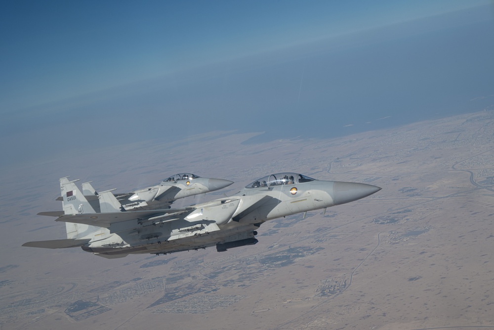 U.S. KC-135s refuel Qatari F-15s during exercise Sky Shield 9
