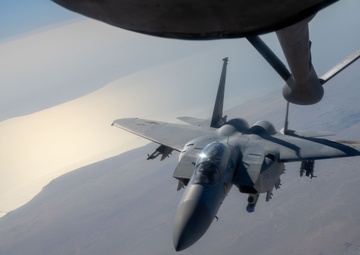 U.S. KC-135s refuel Qatari F-15s during exercise Sky Shield 9