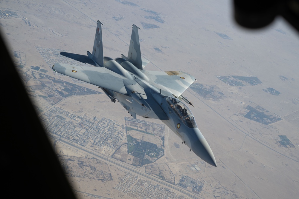 U.S. KC-135s refuel Qatari F-15s during exercise Sky Shield 9