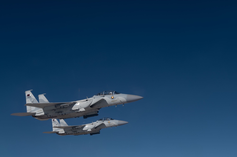 U.S. KC-135s refuel Qatari F-15s during exercise Sky Shield 9
