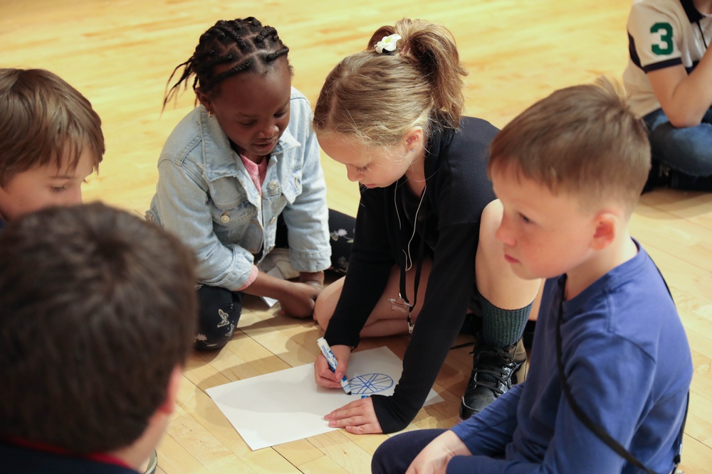 Children problem solve during WRAIR's egg drop competition