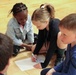 Children problem solve during WRAIR's egg drop competition