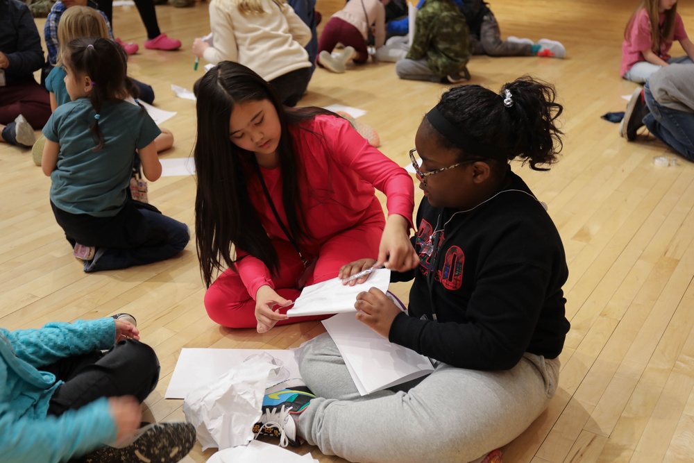 Children problem solve during WRAIR’s egg drop competition