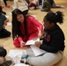 Children problem solve during WRAIR’s egg drop competition