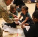 Children problem solve during WRAIR’s egg drop competition