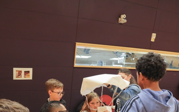 Children problem solve during WRAIR’s egg drop competition