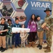 Children problem solve during WRAIR’s egg drop competition