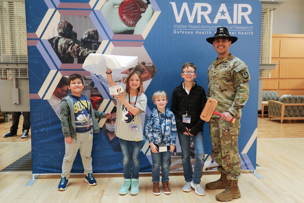 Children problem solve during WRAIR’s egg drop competition