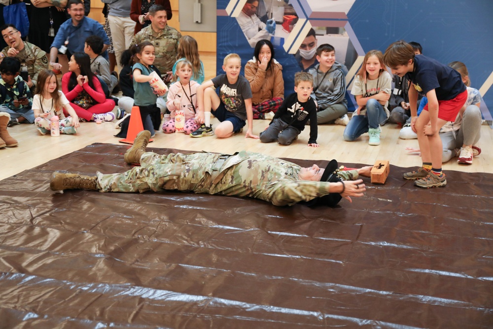 Children problem solve during WRAIR’s egg drop competition