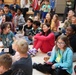 Children problem solve during WRAIR’s egg drop competition