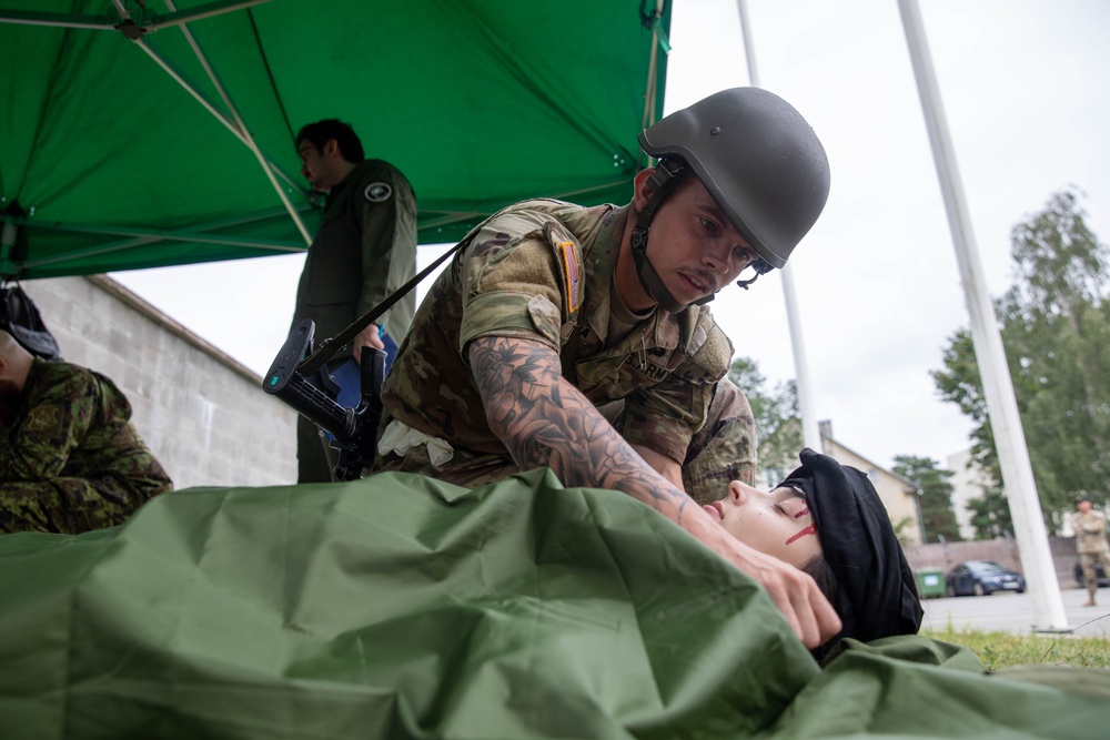 Sgt. Trenton Tuberosa covers a casualty