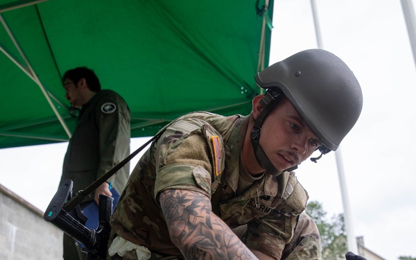 Sgt. Trenton Tuberosa covers a casualty