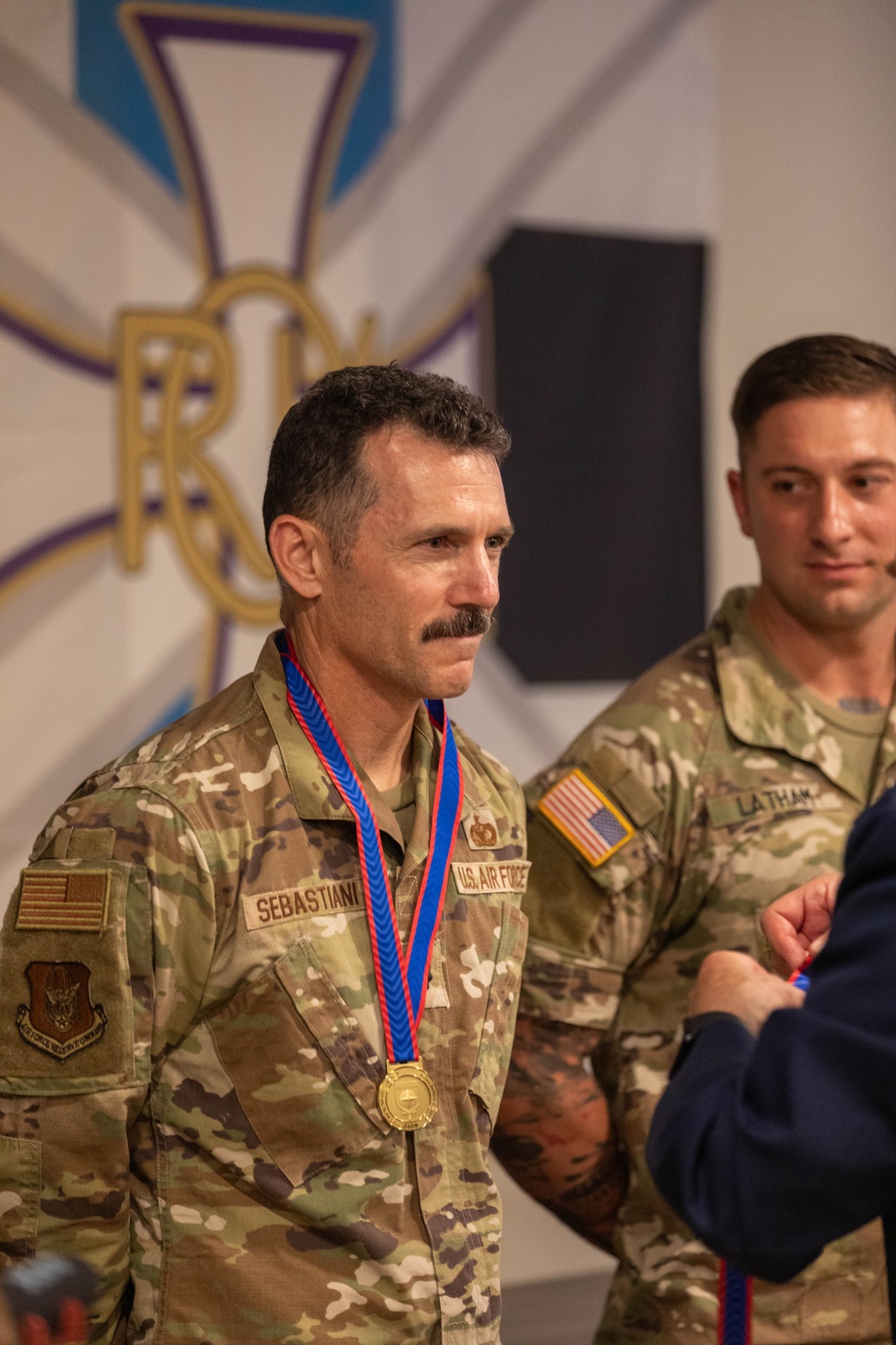 Lt. Col. Thomas Sebastiani receives a gold medal