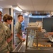 Services specialists prepare meals for Civil Air Patrol cadets