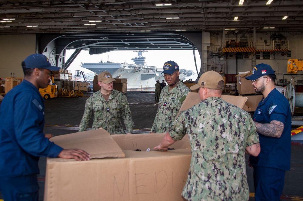 USS Ronald Reagan (CVN 76) Sailors prepare to cross deck to USS George Washington (CVN 73)