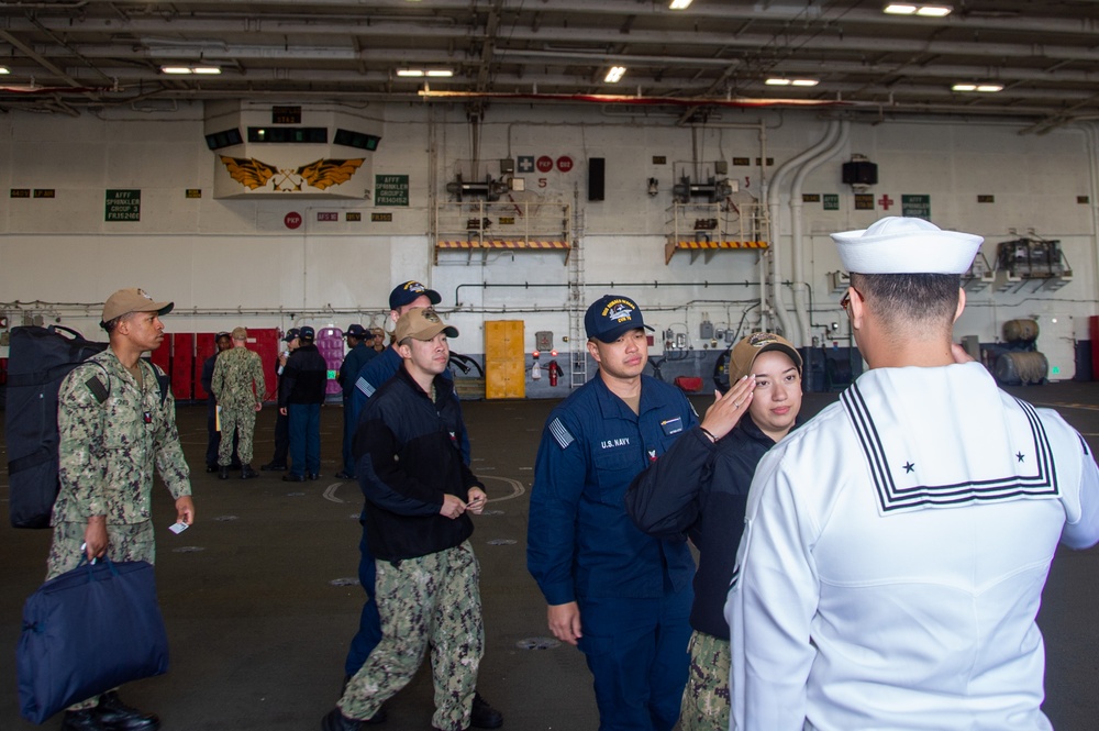 USS Ronald Reagan (CVN 76) Sailors prepare to cross deck to USS George Washington (CVN 73)