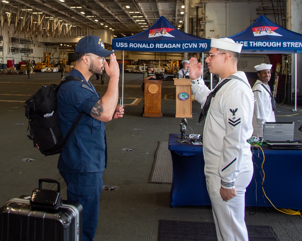 USS Ronald Reagan (CVN 76) Sailors prepare to cross deck to USS George Washington (CVN 73)