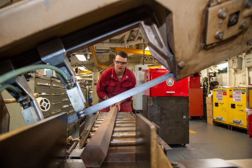 USS Ronald Reagan (CVN 76) Sailors fabricate a machine component