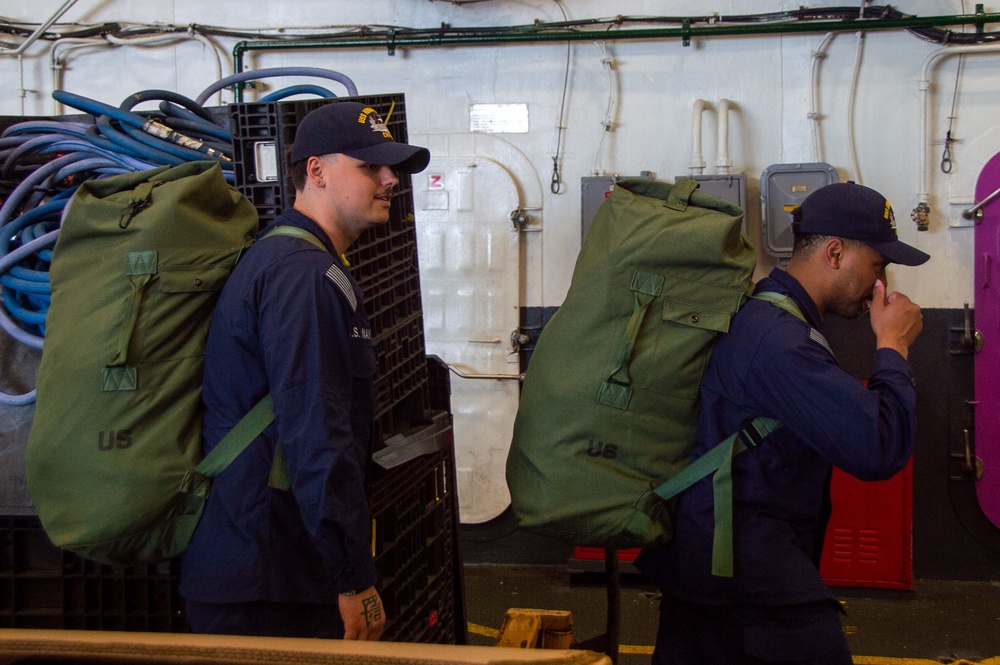 USS Ronald Reagan (CVN 76) Sailors prepare to cross deck to USS George Washington (CVN 73)