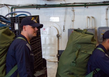 USS Ronald Reagan (CVN 76) Sailors prepare to cross deck to USS George Washington (CVN 73)