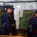 USS Ronald Reagan (CVN 76) Sailors prepare to cross deck to USS George Washington (CVN 73)