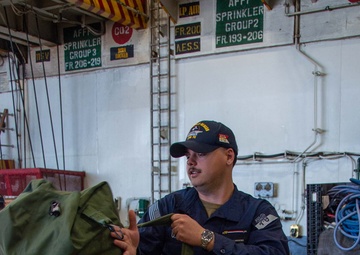 USS Ronald Reagan (CVN 76) Sailors prepare to cross deck to USS George Washington (CVN 73)