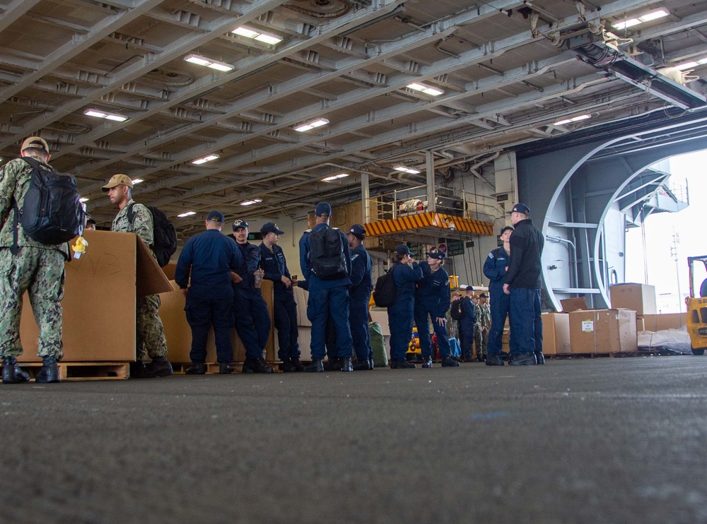 USS Ronald Reagan (CVN 76) Sailors prepare to cross deck to USS George Washington (CVN 73)