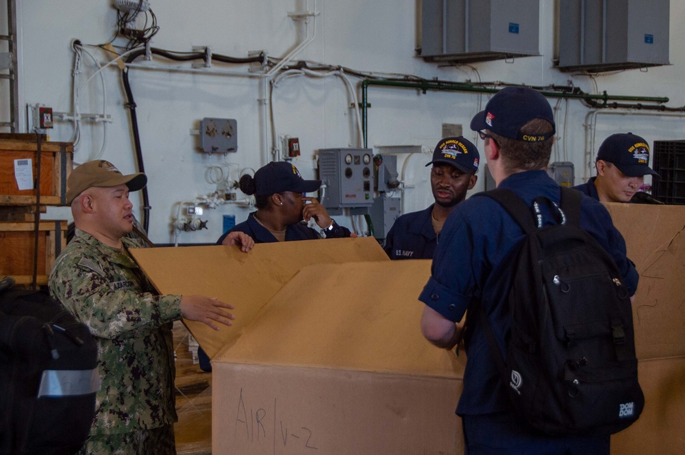 USS Ronald Reagan (CVN 76) Sailors prepare to cross deck to USS George Washington (CVN 73)