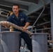 USS Carl Vinson (CVN 70) Sailors Heave Line on the Fantail