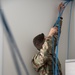 U.S. Air Force Staff Sgt. Timothy Winkler runs all new wires and networks in a new Blackfeet Tribal Health IT building